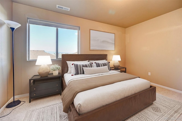 bedroom with light colored carpet