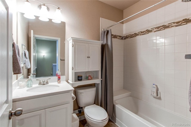 full bathroom with vanity, shower / bath combo, and toilet