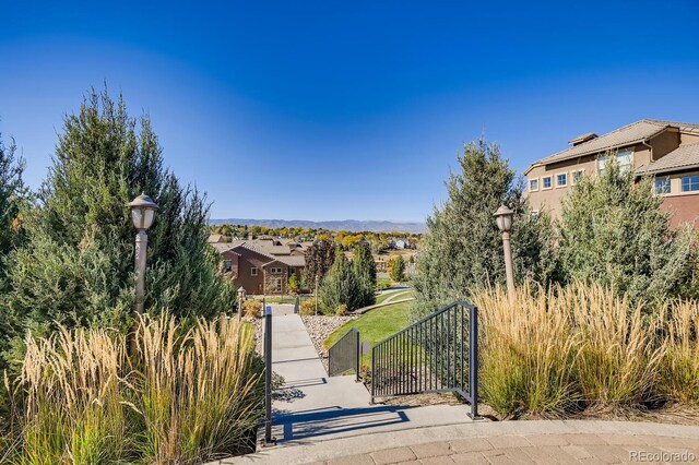 view of front facade featuring a residential view, a gate, and fence