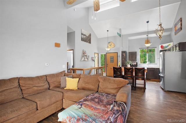 living room featuring high vaulted ceiling, dark hardwood / wood-style floors, and ceiling fan