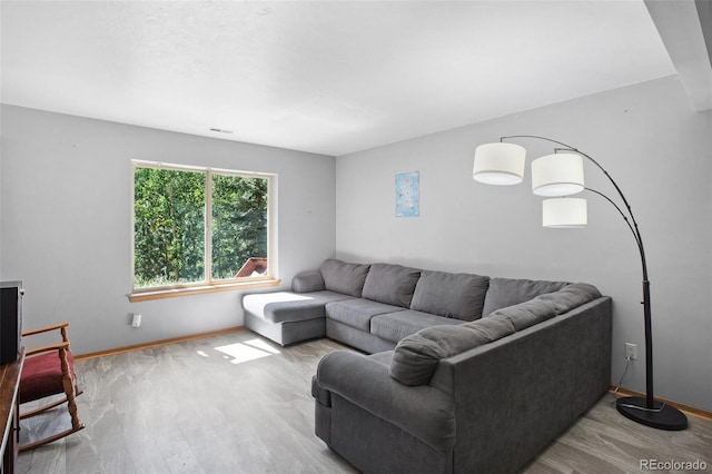 living room with light hardwood / wood-style floors