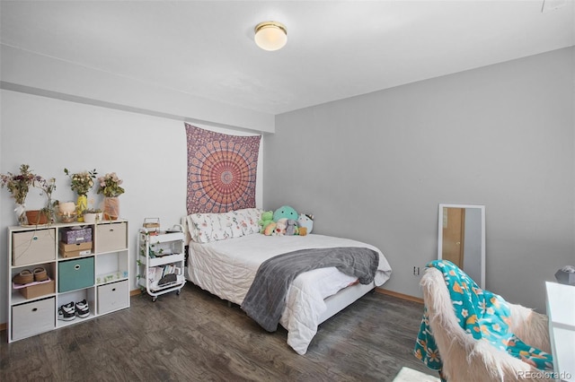 bedroom with dark hardwood / wood-style flooring