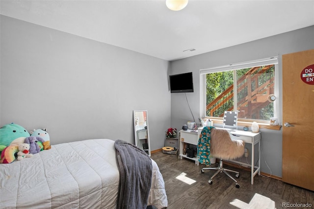 bedroom featuring dark hardwood / wood-style flooring