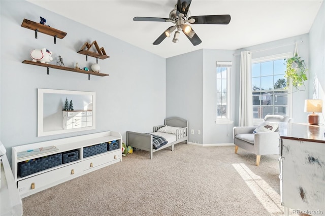 interior space featuring ceiling fan and light colored carpet