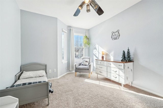 carpeted bedroom with ceiling fan