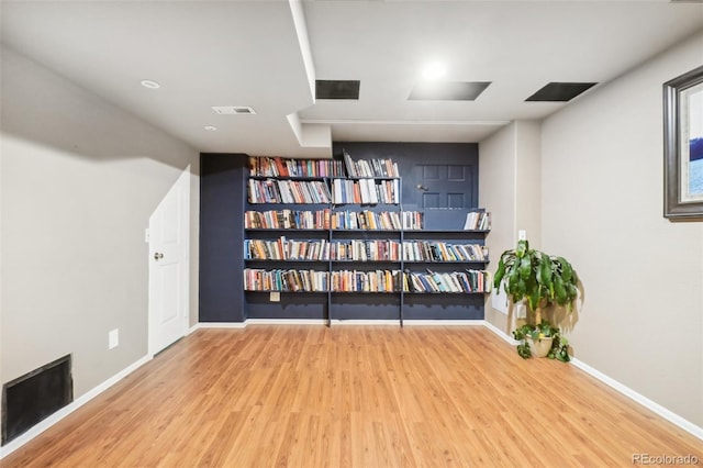 unfurnished room with wood-type flooring