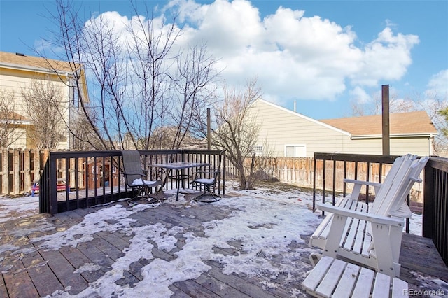 view of snow covered deck