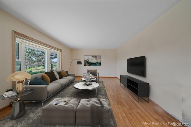 living room with wood finished floors and baseboards