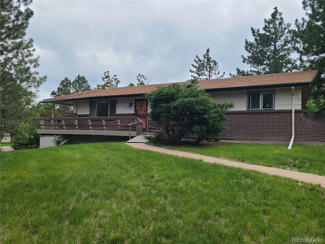 5274 W Rowland Pl, Littleton, CO 80128 - view of front of house featuring a front lawn