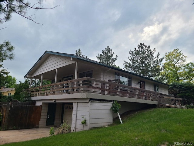5274 W Rowland Pl, Littleton, CO 80128 - rear view of house featuring a wooden deck
