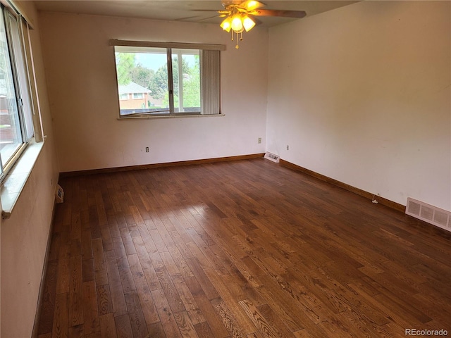 5274 W Rowland Pl, Littleton, CO 80128 - spare room featuring dark wood-type flooring, a ceiling fan, and baseboards