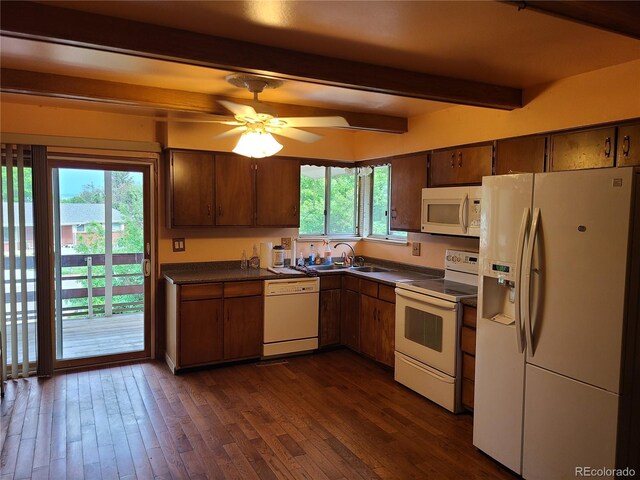 5274 W Rowland Pl, Littleton, CO 80128 - kitchen featuring white appliances, dark countertops, beam ceiling, a sink, and dark wood-type flooring