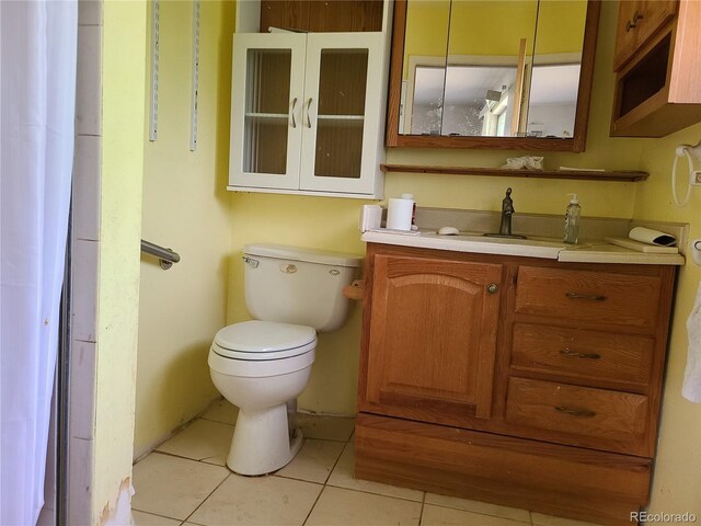 5274 W Rowland Pl, Littleton, CO 80128 - half bathroom featuring toilet, vanity, and tile patterned floors