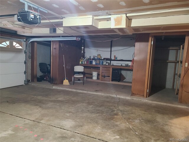 5274 W Rowland Pl, Littleton, CO 80128 - garage featuring a workshop area and a garage door opener