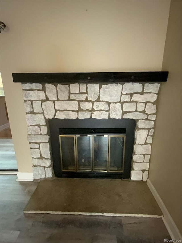 details with a fireplace and concrete floors