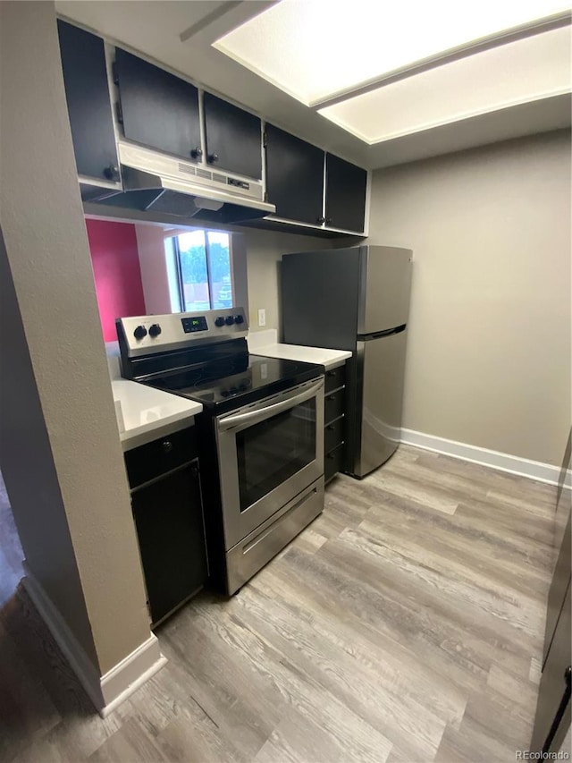 kitchen featuring light hardwood / wood-style flooring and electric stove