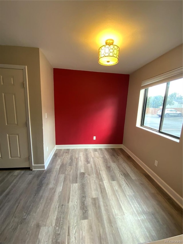 empty room featuring hardwood / wood-style flooring