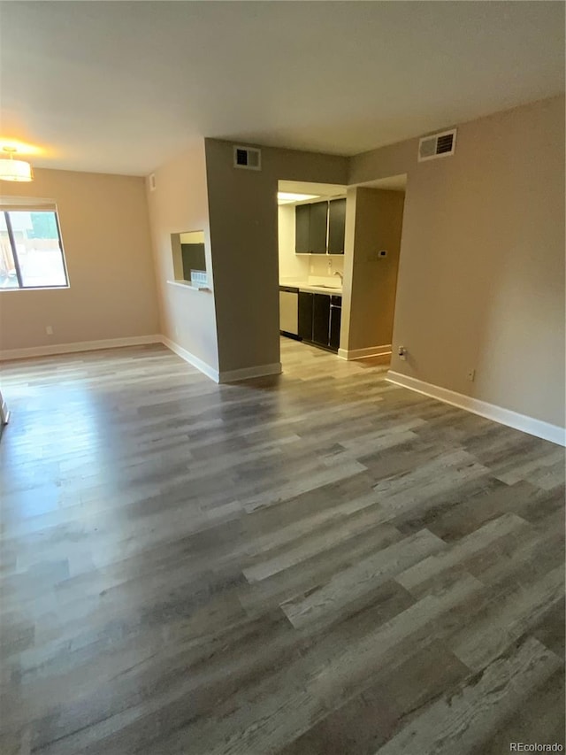 unfurnished living room with hardwood / wood-style flooring