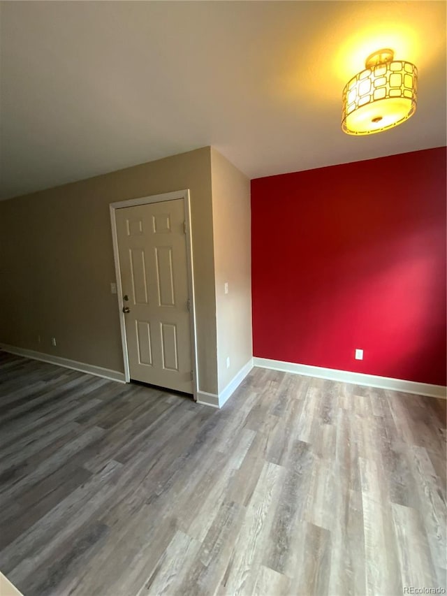 unfurnished room featuring hardwood / wood-style floors