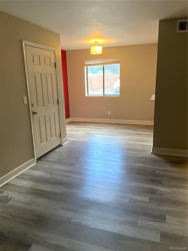 unfurnished room featuring wood-type flooring