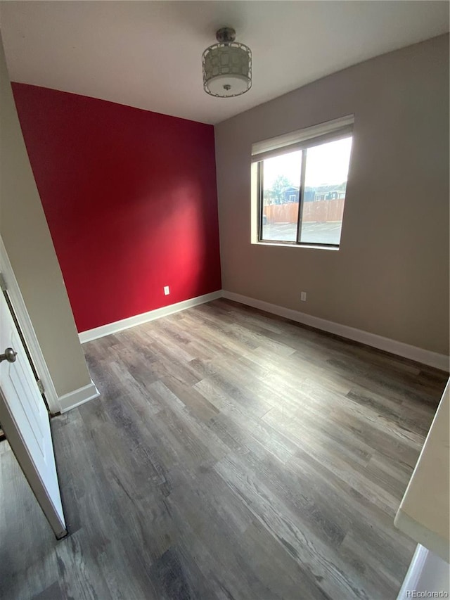 spare room with hardwood / wood-style flooring