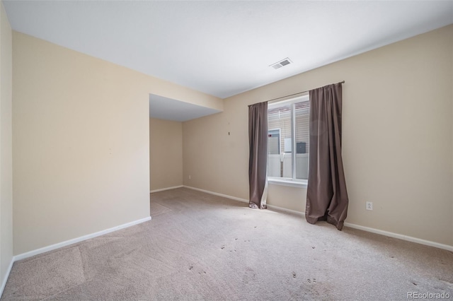 empty room with carpet flooring and baseboards