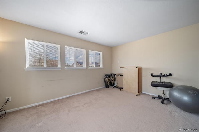 exercise area with carpet floors and baseboards