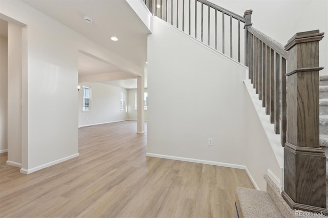 stairs with wood-type flooring