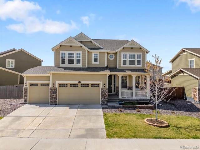 craftsman inspired home featuring fence, an attached garage, a front lawn, covered porch, and driveway