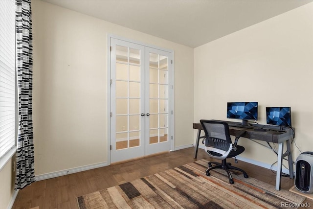 office space with baseboards, french doors, and wood finished floors