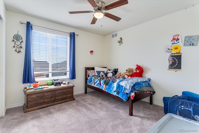 bedroom featuring a ceiling fan, baseboards, light colored carpet, and visible vents