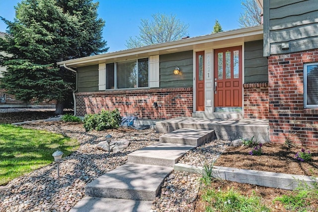 entrance to property with brick siding
