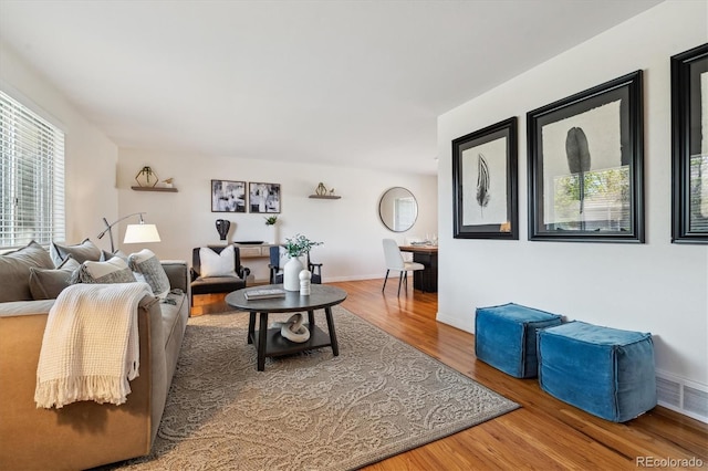 living room with wood finished floors and baseboards