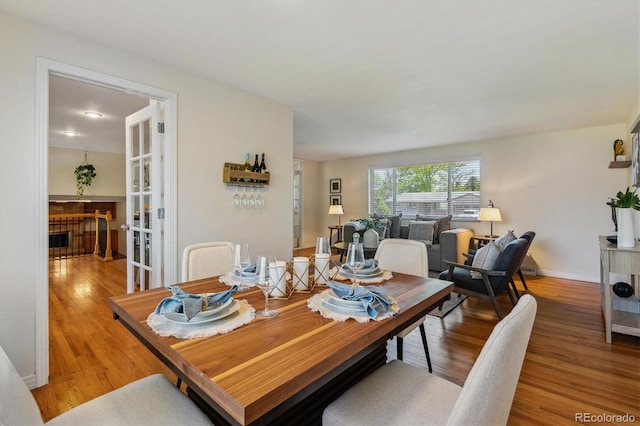 dining area featuring wood finished floors and baseboards