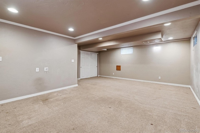 below grade area with carpet, recessed lighting, crown molding, and baseboards