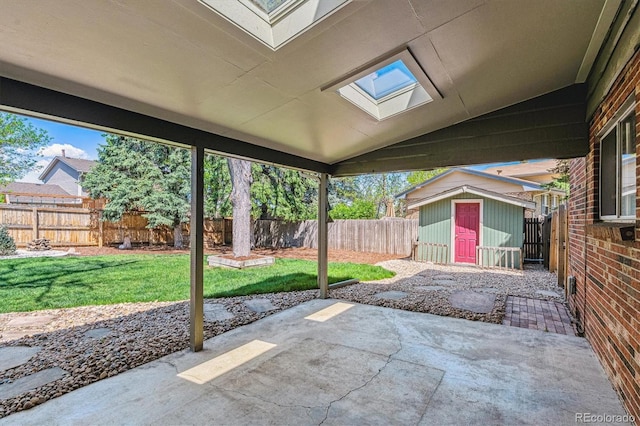 view of patio / terrace with a storage unit and an outbuilding