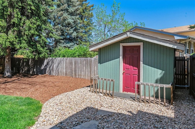 view of shed with a fenced backyard