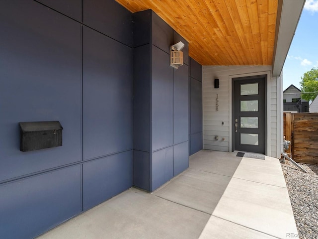 doorway to property with fence
