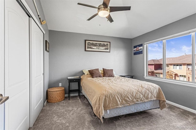 bedroom with a closet, ceiling fan, and carpet floors