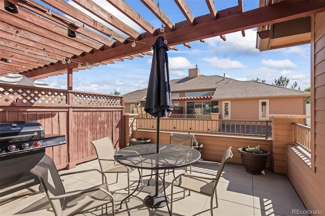 view of patio / terrace featuring grilling area and a pergola