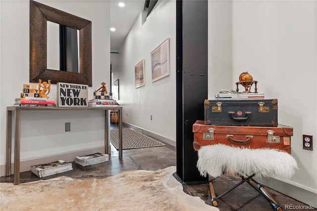 interior space with concrete flooring, recessed lighting, and baseboards