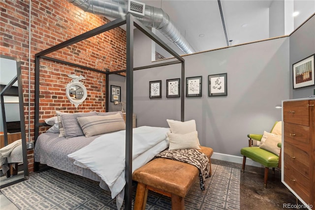 bedroom featuring finished concrete flooring, visible vents, baseboards, brick wall, and a high ceiling