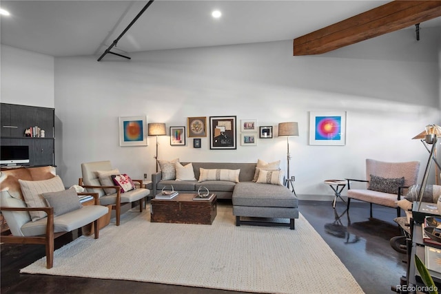 living area featuring concrete flooring, recessed lighting, and beamed ceiling