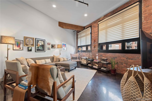 living room with recessed lighting, beamed ceiling, finished concrete flooring, and brick wall