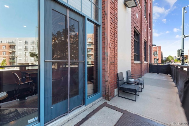 2500 Walnut St Unit 106, Denver, CO 80205 - view of exterior entry with brick siding and a balcony