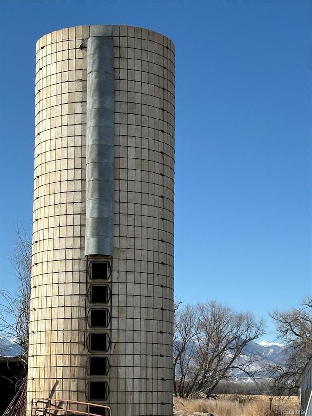 view of building exterior featuring a mountain view