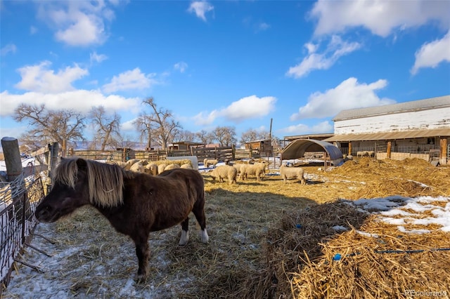 view of yard featuring an outbuilding and a rural view