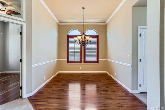 23029 Cleveland Dr, Parker, CO 80138 - unfurnished dining area with crown molding, a chandelier, and wood finished floors