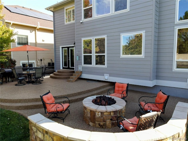 23029 Cleveland Dr, Parker, CO 80138 - view of patio featuring entry steps and a fire pit