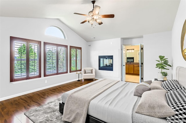23029 Cleveland Dr, Parker, CO 80138 - bedroom featuring lofted ceiling, wood finished floors, a ceiling fan, and ensuite bath